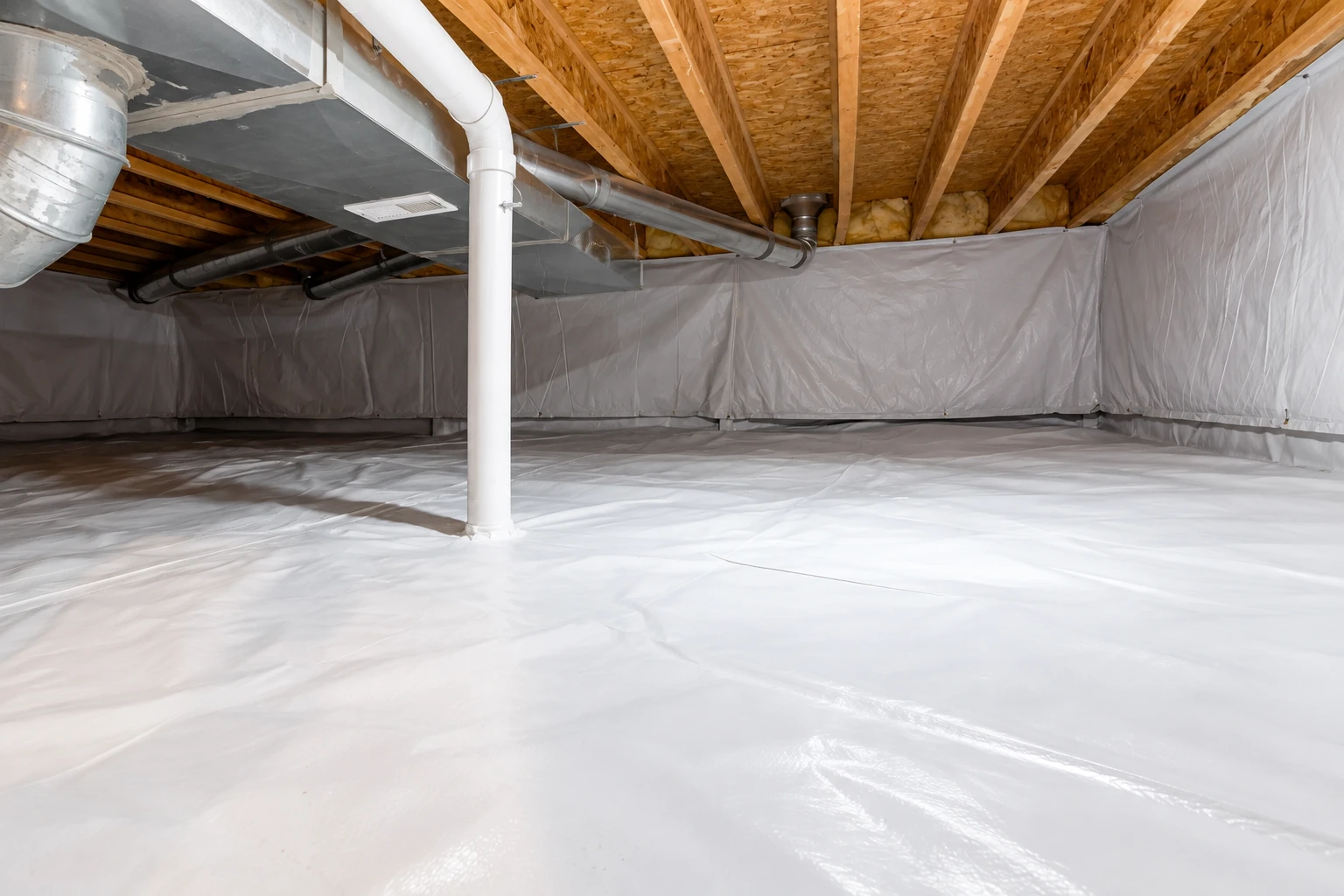 A crawl space is lined with white plastic vapor barrier across the floor and walls, with ductwork and a support post overhead.